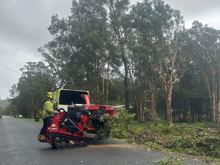 Truck and wood chipper on a tree job